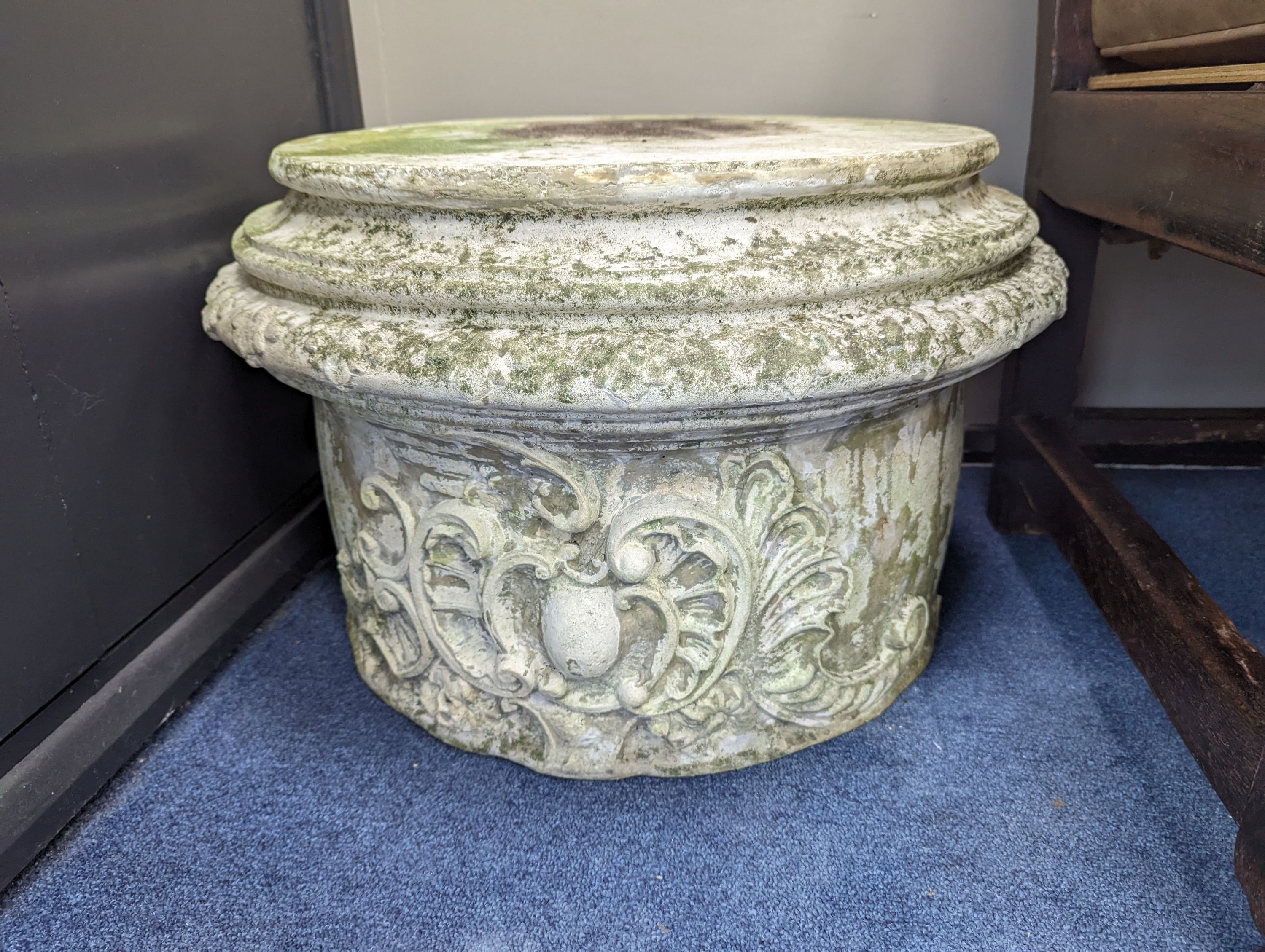 A pair of reconstituted stone circular garden plinths, diameter 60cm, height 38cm